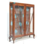 A 20TH CENTURY QUEEN ANNE CHINA DISPLAY CABINET.