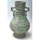 A ANTIQUE CHINES BRONZE VASE OF A BULBOUS FORM