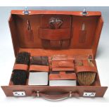 A MID CENTURY LEATHER TRAVELLER VANITY CASE.