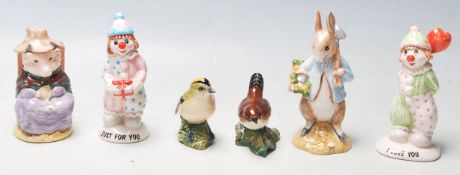 A COLLECTION OF BESWICK CLOWNS, RABBIT, PIG,AND BIRS