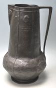 A early 20th century Art Nouveau pewter jug with t