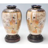 A pair of antique early 20th Century kutani vases with gilt and cobalt blue decoration and twin