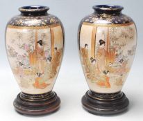 A pair of antique early 20th Century kutani vases with gilt and cobalt blue decoration and twin