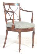 A 19th Century Victorian mahogany bedroom carver chair having a curved cross stretch back with