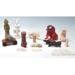 A collection of early and late 20th century Chinese oriental stone statues figurines depicting
