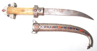 An antique 20th century  Arabian / Middle Easten Koummya Jambiya dagger having bone handle with