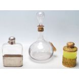A collection of three vintage glass bottles/vessels comprising of a uranium green glass and