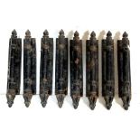 A set of eight industrial salvage 19th century antique gothic style cast iron door handles having