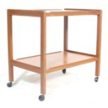 A mid century Danish inspired teak wood butlers serving trolley. Raised on the original large