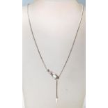 A white metal and opal ladies necklace in the form