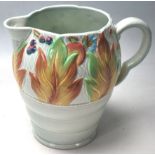 A CLARICE CLIFF WATER JUG WITH CELTIC LEAF AND BERRY PATTERN