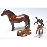 A group of four 20th century Beswick ceramic horses to include Warlord, Another Star, and other