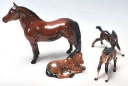 A group of four 20th century Beswick ceramic horses to include Warlord, Another Star, and other