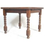 A vintage mid century oak draw leaf dining table having a square table top with leaves underneath