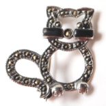 A STAMPED 925 SILVER BROOCH IN THE FORM OF A CAT SET WITH MARCASITES AND ENAMEL PANELS