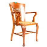 AN OAK VICTORIAN CAPTAIN CHAIR / DESK CHAIR.