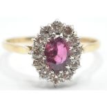 A STAMPED 14K YELLOW GOLD RUBY AND DIAMOND RING OF 1.8 CT'S.