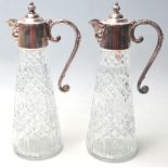 TWO SILVER PLATED AND CUT GLASS CLARET JUG