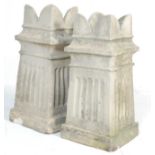 A pair of early 20th century stone King chimney pots having crown styling to the top over a column