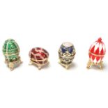A group of vintage 20th century Russian enamelled Faberge style egg shape boxes with hinged lids,