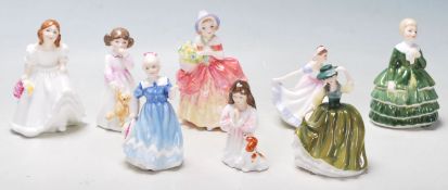 EIGHT ROYAL DOULTON CERAMIC / PORCELAIN FIGURINES