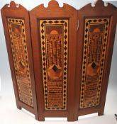 A 20th Century Sorrento ware marquetry triptych fire screen having geometric wooden panels with