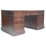 A 19th Century Victorian mahogany twin pedestal office desk of large proportions. Each pedestal