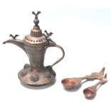 A 19TH CENTURY MIDDLE EAST BRASS COFFEE POT