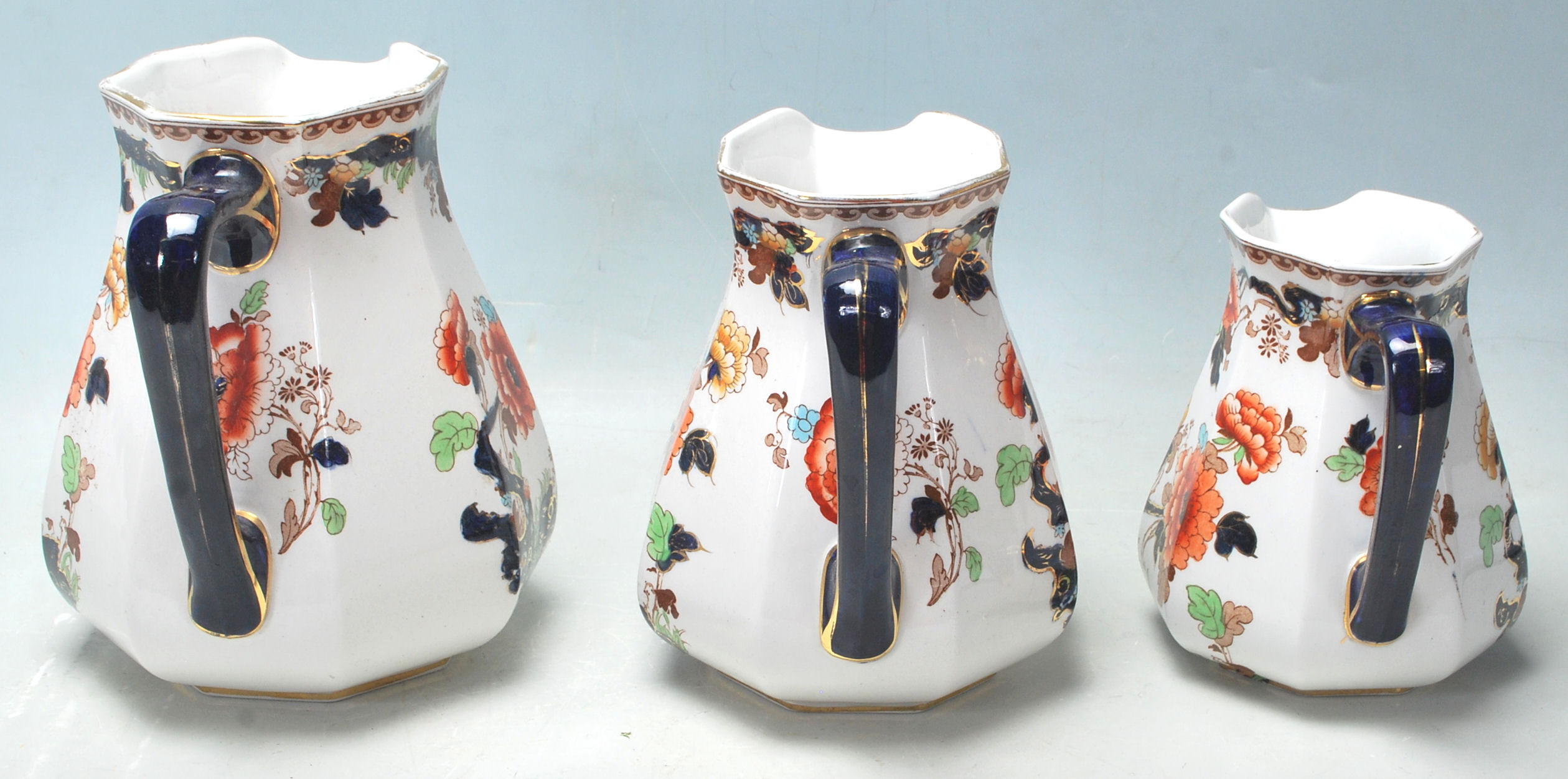 THREE GRADUATING VICTORIAN LOSOL WARE JUGS