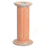 A antique style 20th century terracotta bust stand in a shape of Greek column. Measures 63cm high by