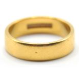 A hallmarked 22ct gold band ring of plain form. Weight 5.6g. Size L.5.