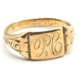 A 9ct gold signet ring with carved shoulders and engraved head. Illegible hallmarks.Weight: 3.50g