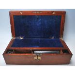 A 19th century Victorian oak writingslope box having brass decoration to the hinged lid opening to