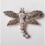 A STAMPED 925 SILVER BROOCH SET WITH CUBIC ZIRCONIA AND MARCASITES IN THE FORM OF A DRAGONFLY