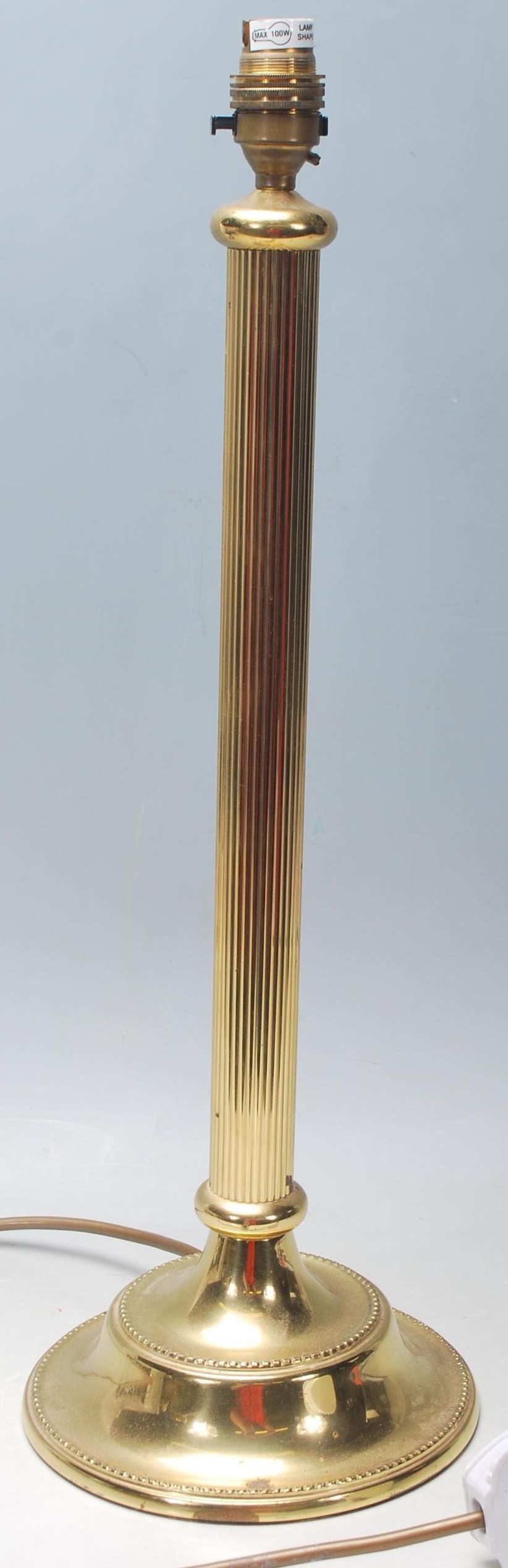 A 20th Century tall brass Corinthian column table