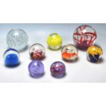 A COLLECTION OF NINE VINTAGE GLASS PAPERWEIGHTS