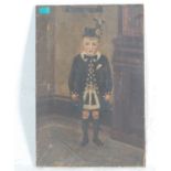 SCOTTISH OIL ON CANVAS PAINTING DEPICTING A BOY IN A KILT