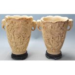 A pair of early 20th Century Chinese resin vases h