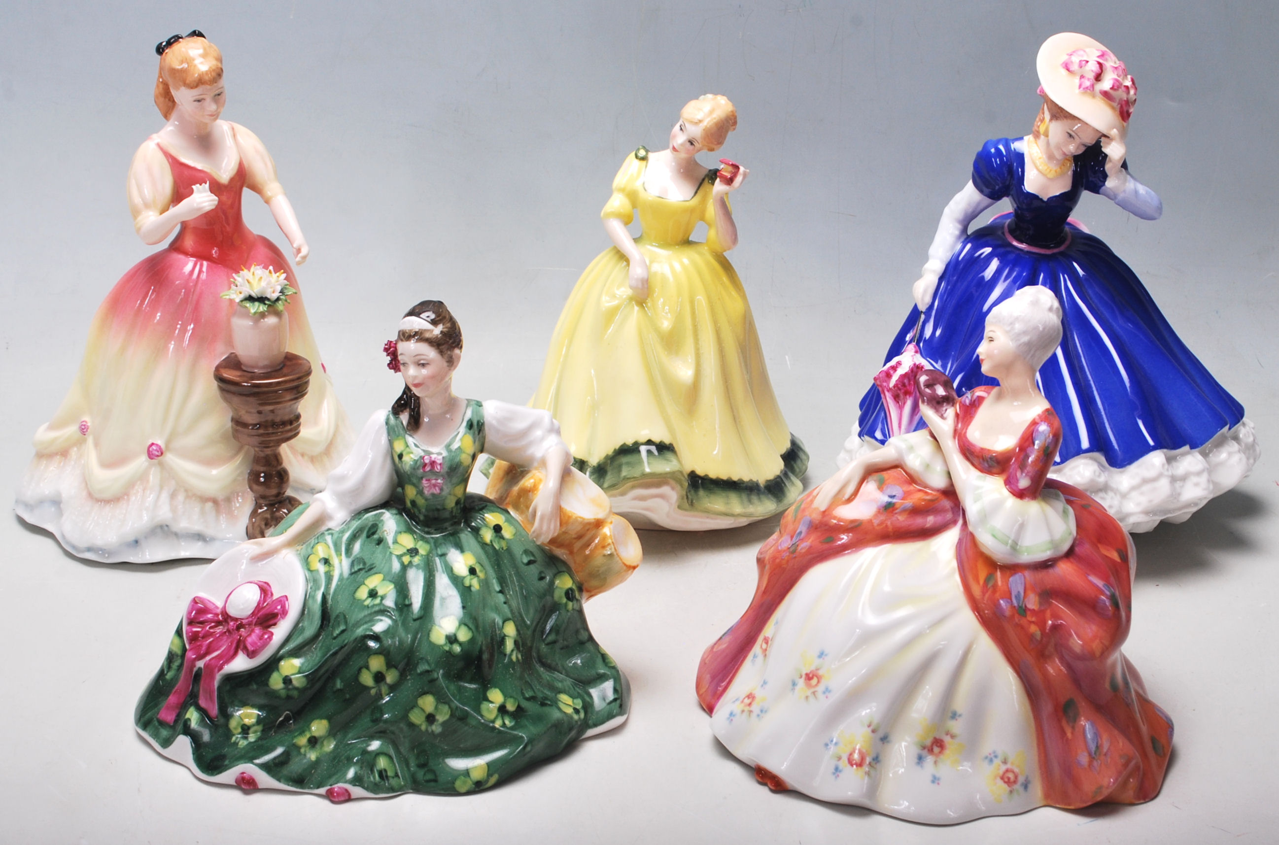 A group of five Royal Doulton ceramic porcelain figurines to include: Wistful HN2396, Figure Of