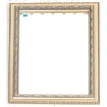 A contemporary antique style gilded wall mirror having bevelled glass mirror,  beaded edge frame and