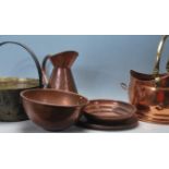 A quantity of early 20th century copper vessels and pans to include jugs, serving trays, cooking