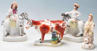 A group of four 19th century Victorian Staffordshire ceramic figurines to include a pair of his
