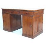 A ANTIQUE ELM KNEEHOLE DESK