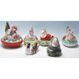 A collection of six late 19th Century Victorian Staffordshire egg baskets all modelled with a hen