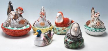 A collection of six late 19th Century Victorian Staffordshire egg baskets all modelled with a hen