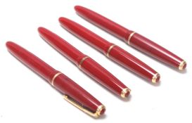 COLLECTION OF FOUR VINTAGE FOUNTAIN PENS