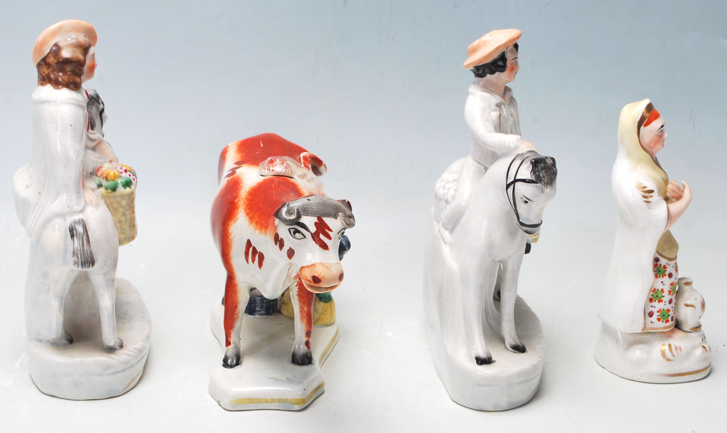 A group of four 19th century Victorian Staffordshire ceramic figurines to include a pair of his - Image 2 of 6