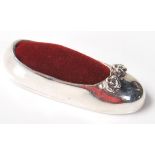 A STAMPED 925 SILVER PIN CUSHION IN THE FORM OF A LADIES SHOE.