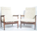 MATCHING PAIR OF TEAK FRAMED RECLINING LOW EASY ARMCHAIRS BY GREAVES AND THOMAS