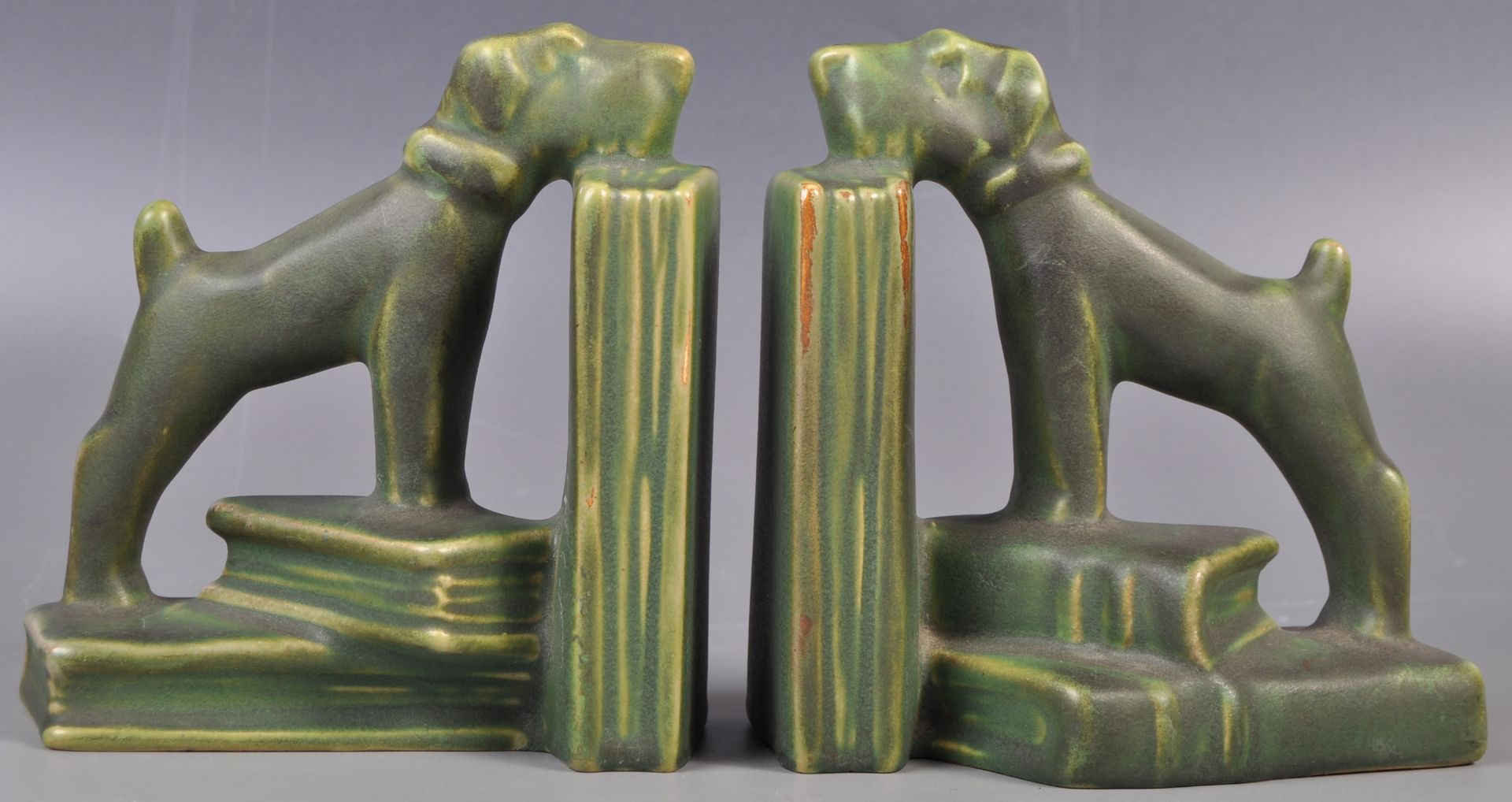 PAIR OF EARLY 20TH CENTURY ART DECO CERAMIC DOG BOOKENDS